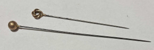 Lot 195 - 2 x hatpins with 9ct rose gold tops - open knot & ball, both marke