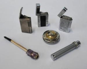 Lot 182 - Group lot - Vintage stylish Gas Cigarette Lighters + Holder w Amethyst Lot 182 - Group lot - Vintage stylish Gas Cigarette Lighters + Holder w Amethyst