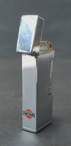 Lot 186 - Vintage Datsun Advertising Gas Cigarette Lighter - stylish chrome, mar