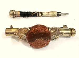 Lot 173 - Antique sewing Etui brooch set with Goldstone - bar contains cottons