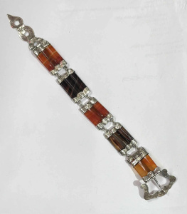 Lot 174 - c1880 Scottish silver and gemstone Buckle bracelet with barrel cut red Lot 174 - c1880 Scottish silver and gemstone Buckle bracelet with barrel cut red