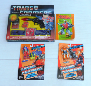 Lot 135 - 3 BoxedCarded Transformer Toys Inc Mainframe With Push Button, Rollout
