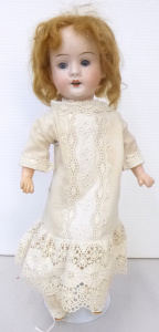 Circa 1900 German Recknagel Bisque Headed Doll with jointed composition body, op
