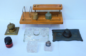 Lot 79 - Group lot of inkwells & desk stands, incl mid-century blondwood, br