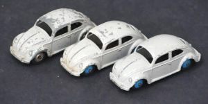 Lot 43 - 3 Vintage Dinky Toys VW Beetles c1950s, oval back windows