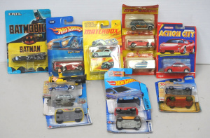 Lot 129 - Group lot of carded die cast cars, including Ertl Tim Burton Batmobile