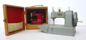 2 x 1950s 60s Toy Sewing Machines inc, cased Japanese Battery Operated & an