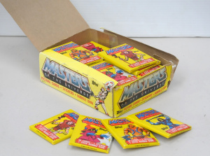 Lot 112 - Full POS Carton of 36 Unopened Packs of Topps Masters of the Universe