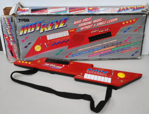 Lot 122 - Boxed 1990 Tyco Hot KEYZ Keytar Synthesizer Keyboard (box Af)