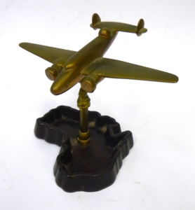 Lot 217 - Vintage Brass Trench Art Hudson Model Aeroplane mounted to Bakelite ma