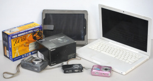 Lot 19 - Box lot of Electronics & Cameras inc Apple MacBook & iPad , Cam