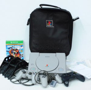 Lot 28 - Playstation 1 (No Cables) with 2 Controllers in Soft Travel Case and 2