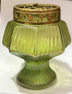 Lot 208 - Loetz Art Nouveau green iridescent glass Vase with brass frog to top -