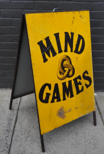 Lot 22 - Retro Mind Games Sandwich Board Sign from Iconic Melbourne Store 107cm Lot 22 - Retro Mind Games Sandwich Board Sign from Iconic Melbourne Store 107cm