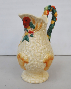 Lot 216 - Vintage Clarice Cliff Celtic Harvest Jug - raised hand painted floral,