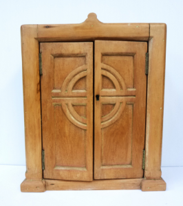 Small Pine Lockable Cabinet with linear and circle design to the front, approx 4