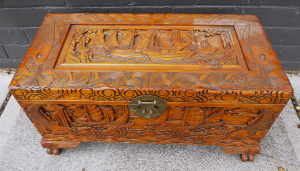 Lot 8 - Light Stained Camphor Wood Chest with heavily carved stylised boating an