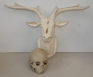 Lot 73 - Retrojan timber stag's head and cement skull garden ornament