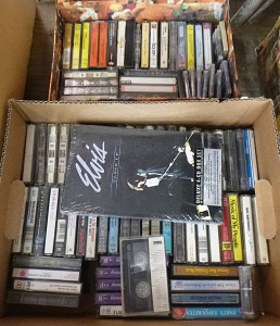 Lot 80 - Lot of 2 boxes of Elvis Cose Up 4 CD box set and cassettes inc Peter An