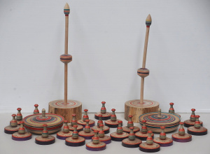 Lot 13 - Collection of hand painted wooden Japanese spinning tops & stands