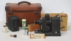 Lot 103 - Vintage Newton & C London Film projector & Accessories with va