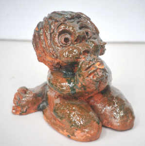 Lot 207 - Unsigned Robert Langley terracotta sculpture of a praying figure 13cm