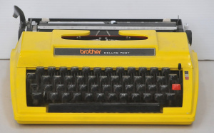 Lot 130 - Retro 1970s bright Yellow Brother Deluxe 700T model Portable Typewrite