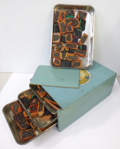 Lot 132 - Vintage 4 trays of wooden with rubber stamps in a wooden box, assorted