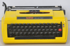 Lot 4 - Retro 1970s bright Yellow Brother Deluxe 700T model Portable Typewriter