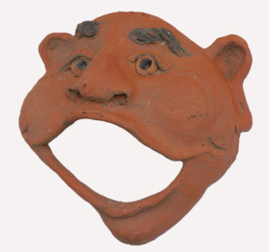 Lot 163 - Australian pottery sculptural comic mask in terracotta, artist unknown