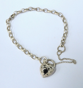 Lot 169 - Vintage Sterling Silver Bracelet - Curb link, Pierced Heart shaped Cla