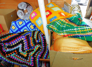 Lot 27 - 3 x Boxes Fabrics, Rugs & haberdashery inc Colourful crocheted rugs