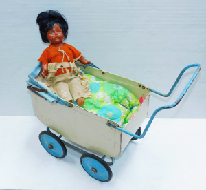 Lot 70 - Vintage Madame Hendren Indian girl doll and pressed metal doll's pram -