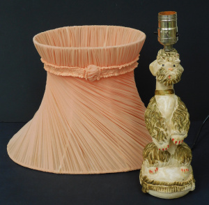 Lot 84 - Vintage plasterware poodle lamp (33cm H) and period ribboned shade