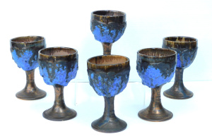 Lot 104 - Set of 6 Robert Beck lava glazed pottery goblets, incised signature to