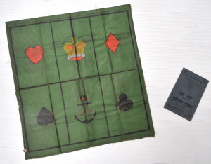 Lot 164 - 2 x Military items - WW2 Crown & Anchor oilskin board game - writt