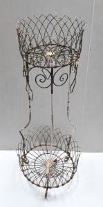 Lot 1 - Victorian two tier wrought iron plant stand - tri footed with scrolls fr