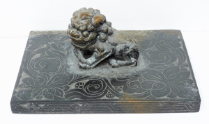 Lot 92 - Antique Chinese granite scroll weight with lion on floral carved base -