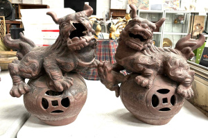 Pr pottery Temple Lions on balls, one damaged - marks to base 45 cms