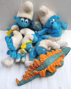 Box lot of vintage Smurf soft toys and a modern stegosaurus soft toy