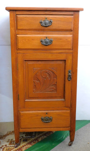 Lot 7 - Edwardian light stained oak 3 drawer unit with pot cabinet on castors -