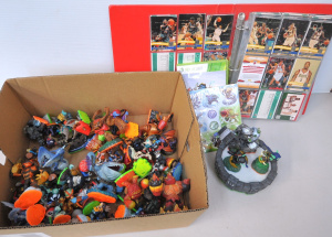 Lot 122 - Box lot Kids items - heaps Modern Skylanders Action figures w cased Xb