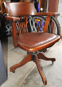 Lot 2 - Vintage oak captain's swivel chair on Bakelite castors - 81cm H