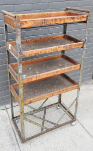 Lot 51 - Vintage industrial rack of shelves on castors with metal frame and timb