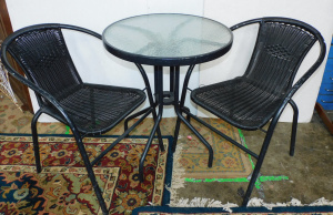 Lot 52 - Black 3 piece outdoor setting inc glass topped round table and 2 faux w