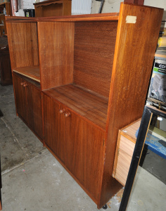 Lot 53 - 1970s double fronted teak veneered wall unit w adjustable shelves - 184