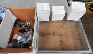 Lot 54 - Portable display case with Perspex and aluminium frame (56cm W), jewell