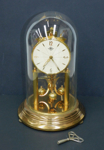 Lot 209 - Vintage German Haller Dome Clock with Key - Glass dome 31cm H