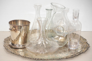 Lot 78 - Group of vintage glass decanters, EP ice bucket, and substantial EP cop