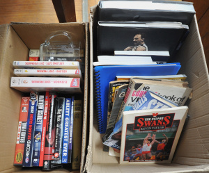Lot 66 - 2 x Boxes of Assorted AFL Items incl Books, Records & DVDs incl Bio